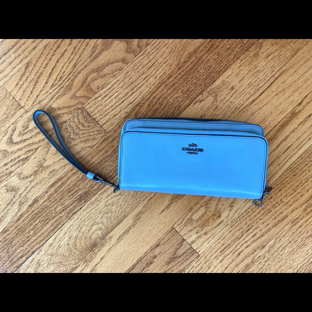 Blue Coach wallet with wrist strap